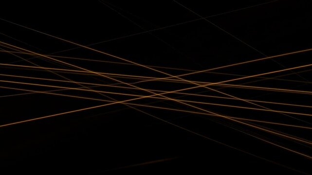 Thin golden glowing lines drift and intersect across a nearly black abstract background. Technology presentation, corporate title sequence, and digital product promotion.
