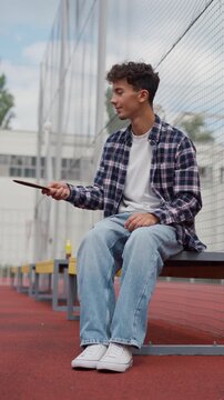 Young man practicing table tennis on a bench