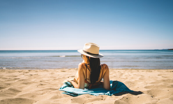 Young woman enjoying summer on the beach