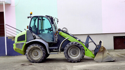 Construction grader bulldozer with loading bucket © Igor