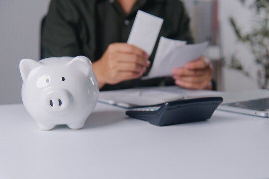 Piggy Bank and Calculator for Financial Planning Concept