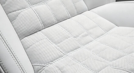 Obraz premium Close-up of luxury white perforated leather car seat with quilted stitching