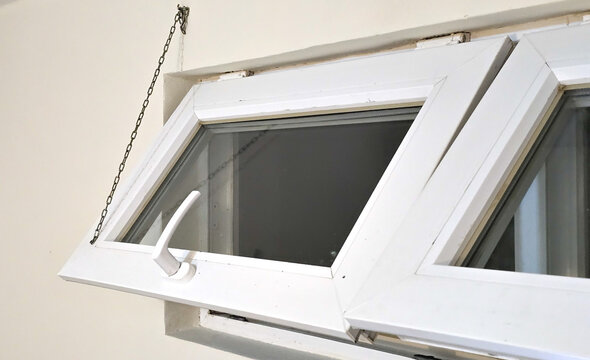 Close-up of a top-hung transom window