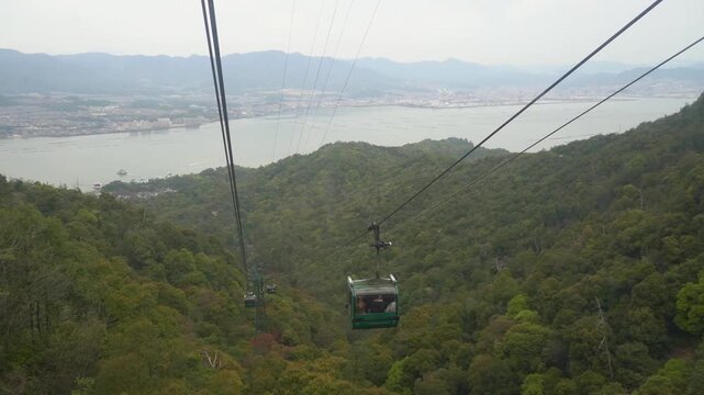 Miyajima Ropeway Cable Car Over Forested Mountains and Sea