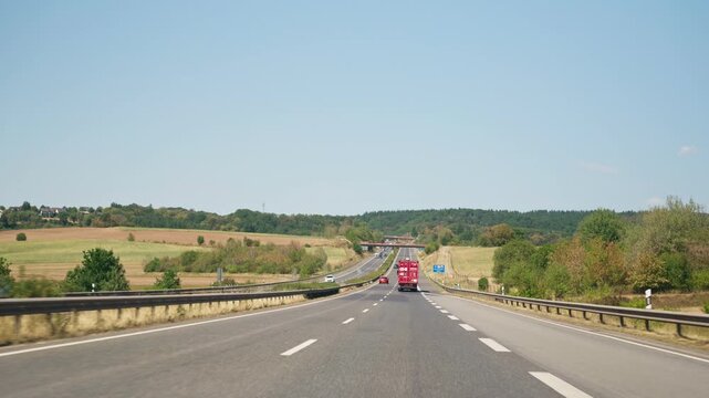 Driving behind a truck with safe distance slow motion on highway