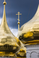 golden cross on the top of a church © orininskaya