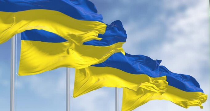 Ukraine national flags waving on a clear day. Eastern Europe
