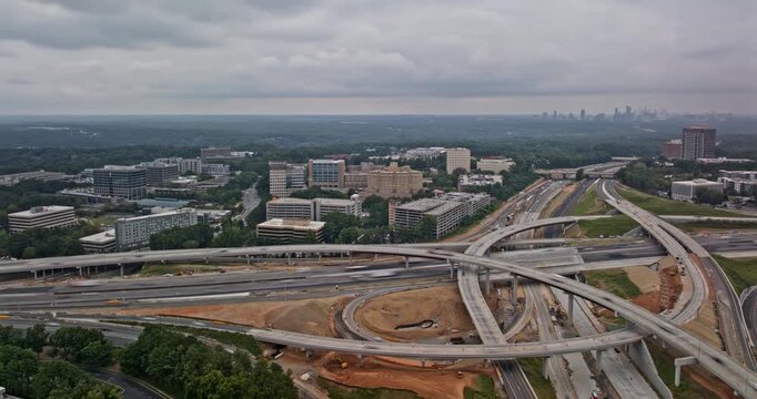 Atlanta Georgia Aerial v998 hyperlapse fly around the freeway interchange capturing vast highway network and massive infrastructure construction projects - Shot with 5k Camera - Sept 14th 2023