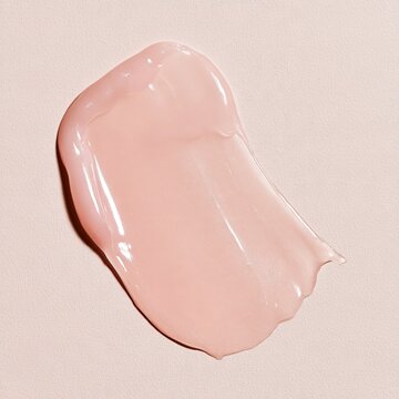 Pink skincare cream swatch displaying beauty product texture