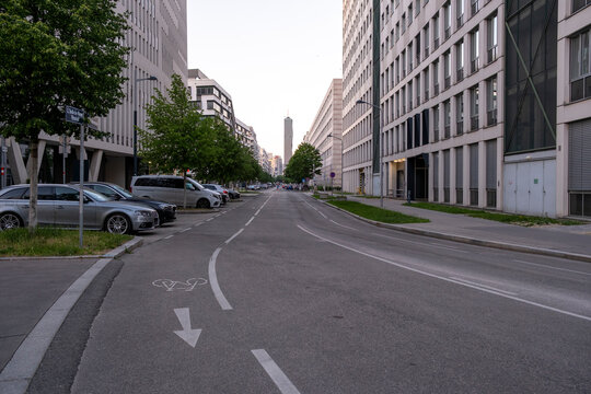 Bicycle lane on a street between buildings in Nordbahnviertel, Vienna, Austria, connecting cycling and urban architecture through the modern street between buildings
