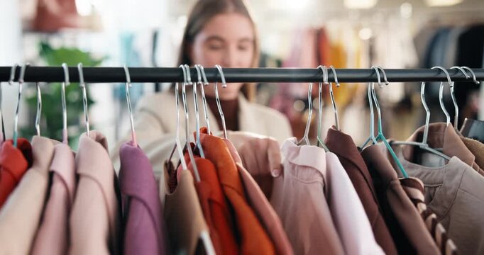 Boutique, choice and hands at clothes rack for shopping, outfit search or garment option on sale. Retail, woman and browsing display rail for apparel decision, store promotion and style for fashion