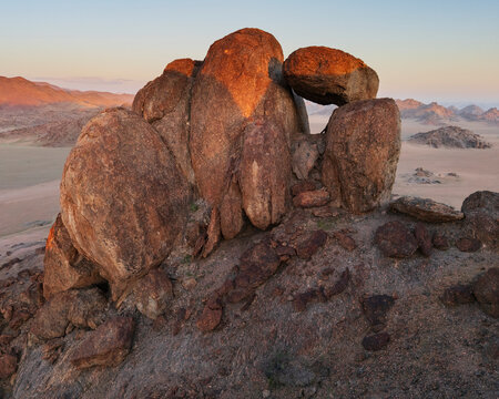 Balanced rock formation at Sunset in stone valley Namibia