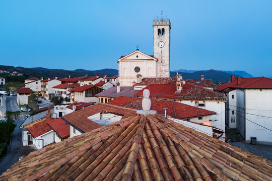 Church of st martin with clock tower at dusk in vipava valley