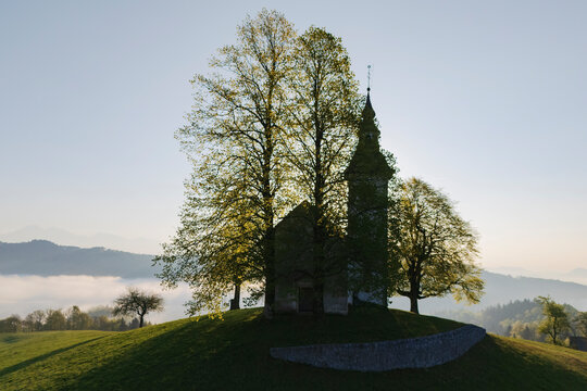 St thomas's church at Sunrise on hill in &scaron;kofja loka Slovenia