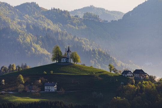 St thomas's church on hilltop at Sunrise in &scaron;kofja loka, Slovenia
