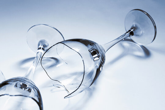 Broken Wine Glass and Intact Glass Symbolizing Comparison and Contrast