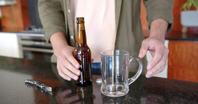 Lifestyle videos indoor of people doing activities at home, holding beer mug and bottle, man enjoyin