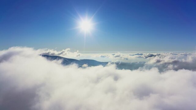 Wonderful view of extraordinary cloudy valley and bright orange sunset