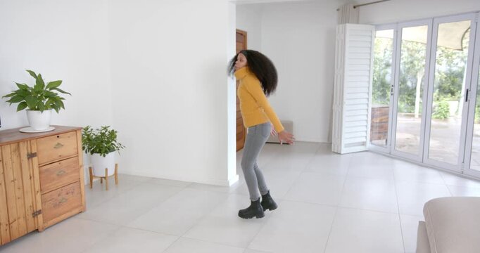 High speed photography for dynamic scenes, jumping and dancing, woman in yellow sweater enjoying tim