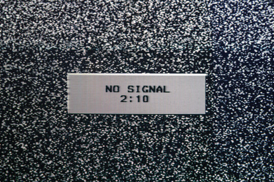No signal message on vintage CRT television screen with analog static noise