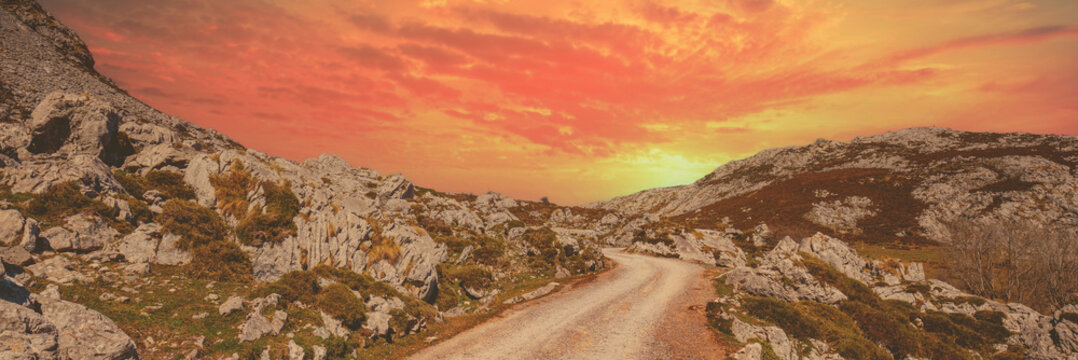 Car driving on a mountain winding road. The road from glacial lake Enol to lake Ercina. National Park Peaks of Europe (Picos de Europa). Asturias, Spain, Europe