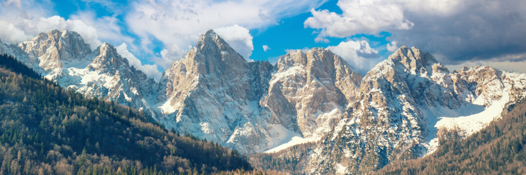View of Alps in Kranjska Gora on a sunny day. The tops of the mountains are covered with snow. Triglav national park. Slovenia, Europe