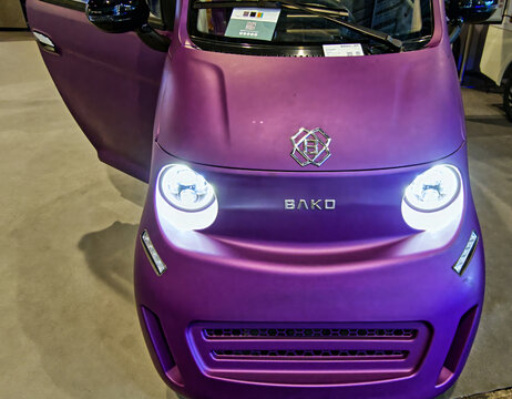 Bako electric city car with vibrant purple matte finish presenting urban mobility innovation at iaa transportation hanover 2026
