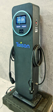 Teison ev charging station with two cables and digital screen, presenting modern electric vehicle charging infrastructure