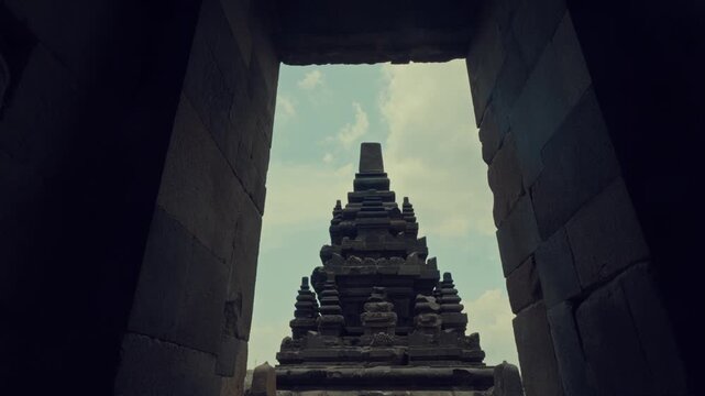 Ancient Temple Spire Framed Through Stone Doorway Silhouette