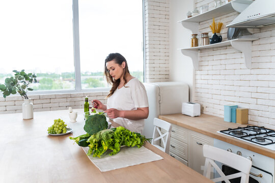 woman preparing a salad in the kitchen