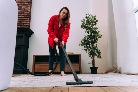 woman cleaning the apartment up