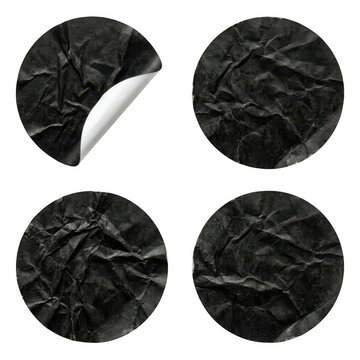 Set of four black crumpled paper stickers with a curled corner isolated on transparent background