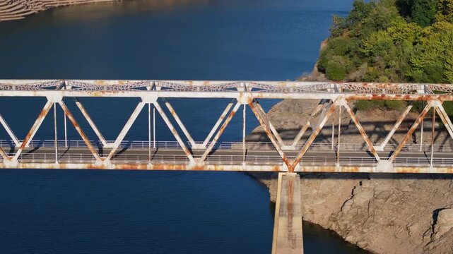 A Metal Truss Bridge, Known as Mourulle Bridge, Crosses the Water Near Xill&aacute;n, Chantada, Spain - Pan Left Shot