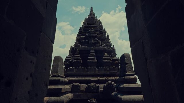 Majestic Temple Tower Framed Through Dark Stone Window
