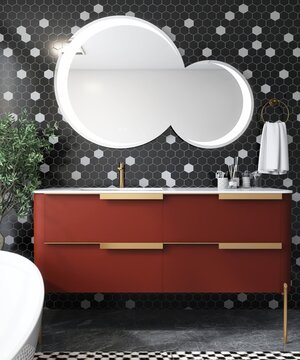 Contemporary, modern bathroom with terracotta red vanity, white marble top, overlapping round mirror on black and white hexagon mosaic tile wall in sunlight. Interior design decoration background 3D