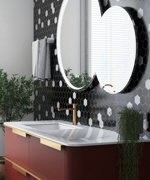 Contemporary, modern bathroom with terracotta red vanity, white marble top, overlapping round mirror on black and white hexagon mosaic tile wall in sunlight. Interior design decoration background 3D