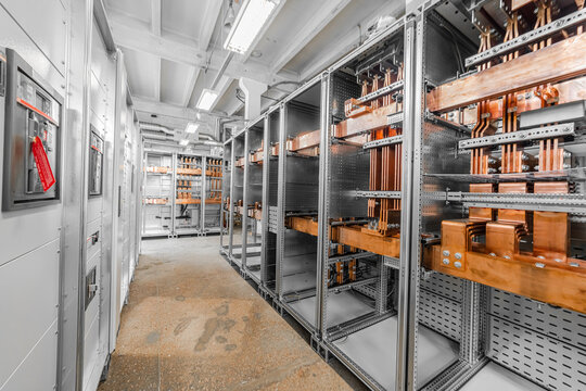 View of industrial electrical switchgear cabinets with copper busbars and technical infrastructure in Latvia.