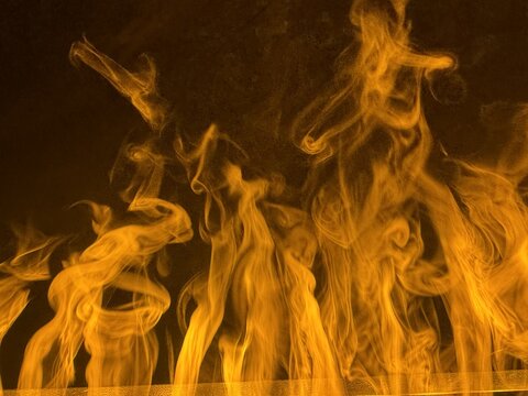 View of flickering orange flames in an electric fireplace in a spa setting in Banya, Blagoevgrad Province, Bulgaria.