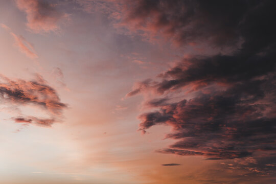 View of a dramatic sunset sky with vibrant pink and orange clouds over the horizon in Merikula, Harju maakond, Estonia.