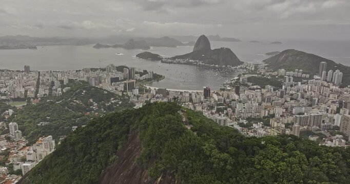 Rio de Janeiro Brazil Aerial v12 flyover around mountain ridge capturing urban cityscape and Sugarloaf Mountain at the entrance to Guanabara Bay - Shot with 5k Camera - Mar 25th 2024