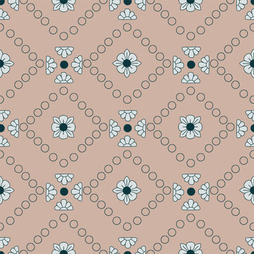 Seamless classical trellis pattern with floral motifs in dotted diamond frames on dusty blush background. Ornamental heritage vector pattern for wallpaper and fabric