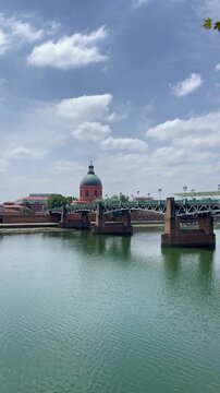 Saint-Pierre Bridge and Dome over the Garonne River in Toulouse France Under Sunny Sky