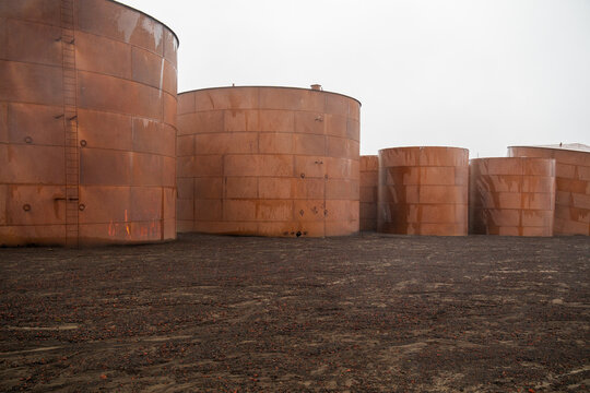 View of rusted oil storage tanks at Deception Island in Antarctica.