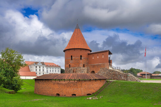 Kaunas Castle in Kaunas, Lithuania, low angle view from the dry moat. Red brick medieval fortification walls and defensive tower