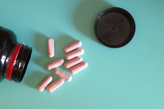 Capsules spilled from an open bottle