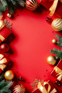 Christmas background with red gift boxes and golden decorations