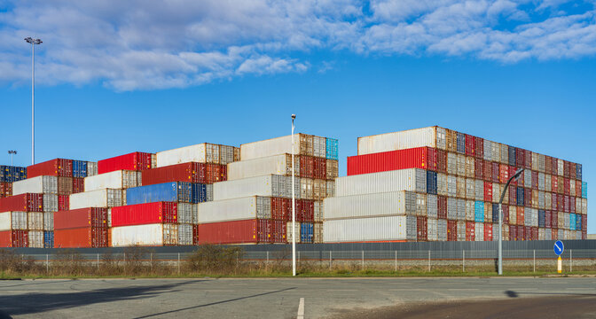 View of stacked shipping containers in various colors at the port terminal in Klaipeda, Klaipeda County, Lithuania.