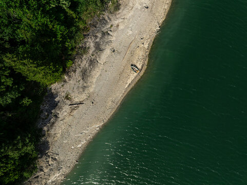 Aerial View of Sylvenstein Reservoir with Low Water Levels During Summer Drought, Bavaria, Germany