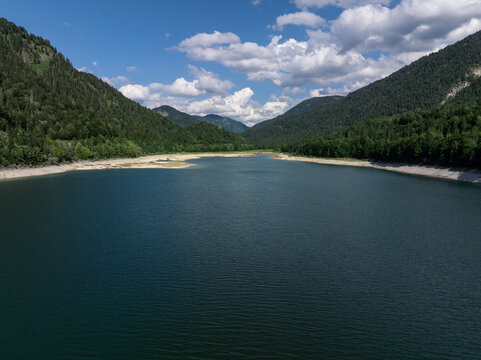 Aerial View of Sylvenstein Reservoir with Low Water Levels During Summer Drought, Bavaria, Germany