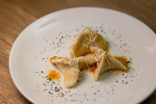 Cjarsons from Carnia, traditional sweet Friulian ravioli dressed with butter